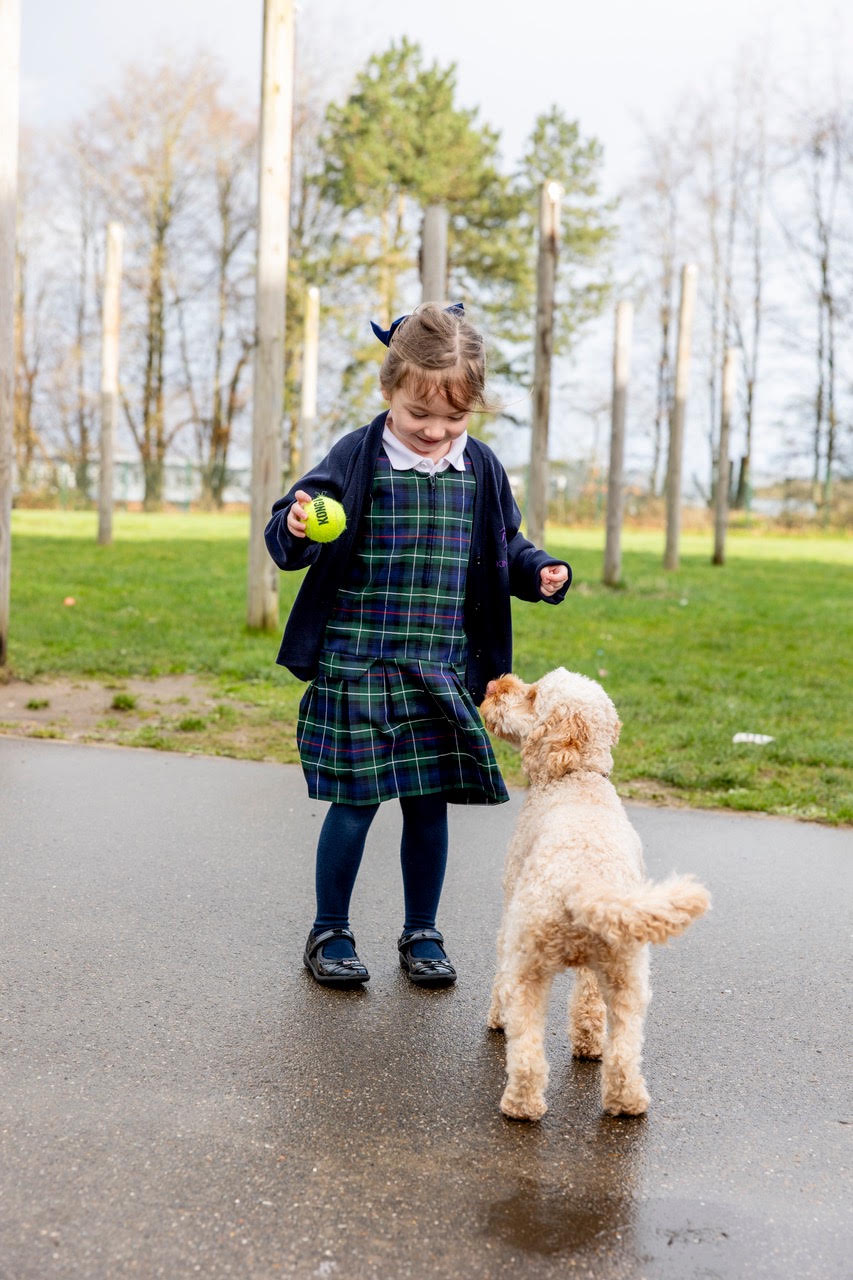A pupil offering Skye a ball